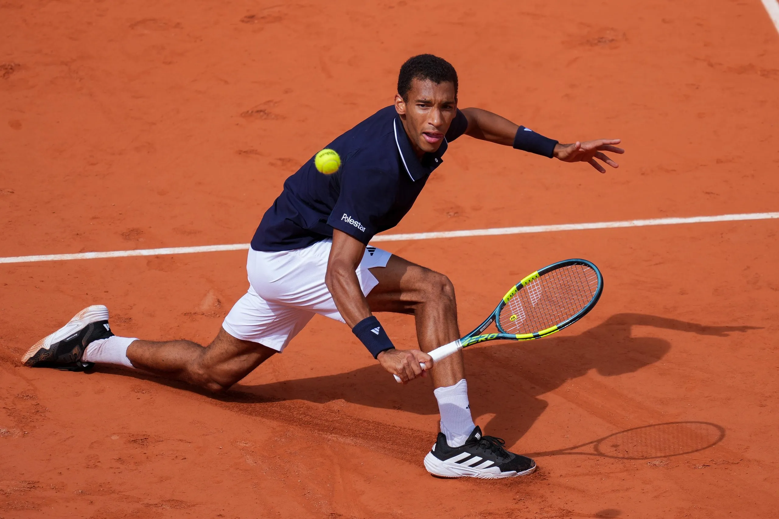 Felix Auger-Aliassime of Canada plays a volley against Flavio Cobolli of Italy during their Men’s Singles quarter-final match