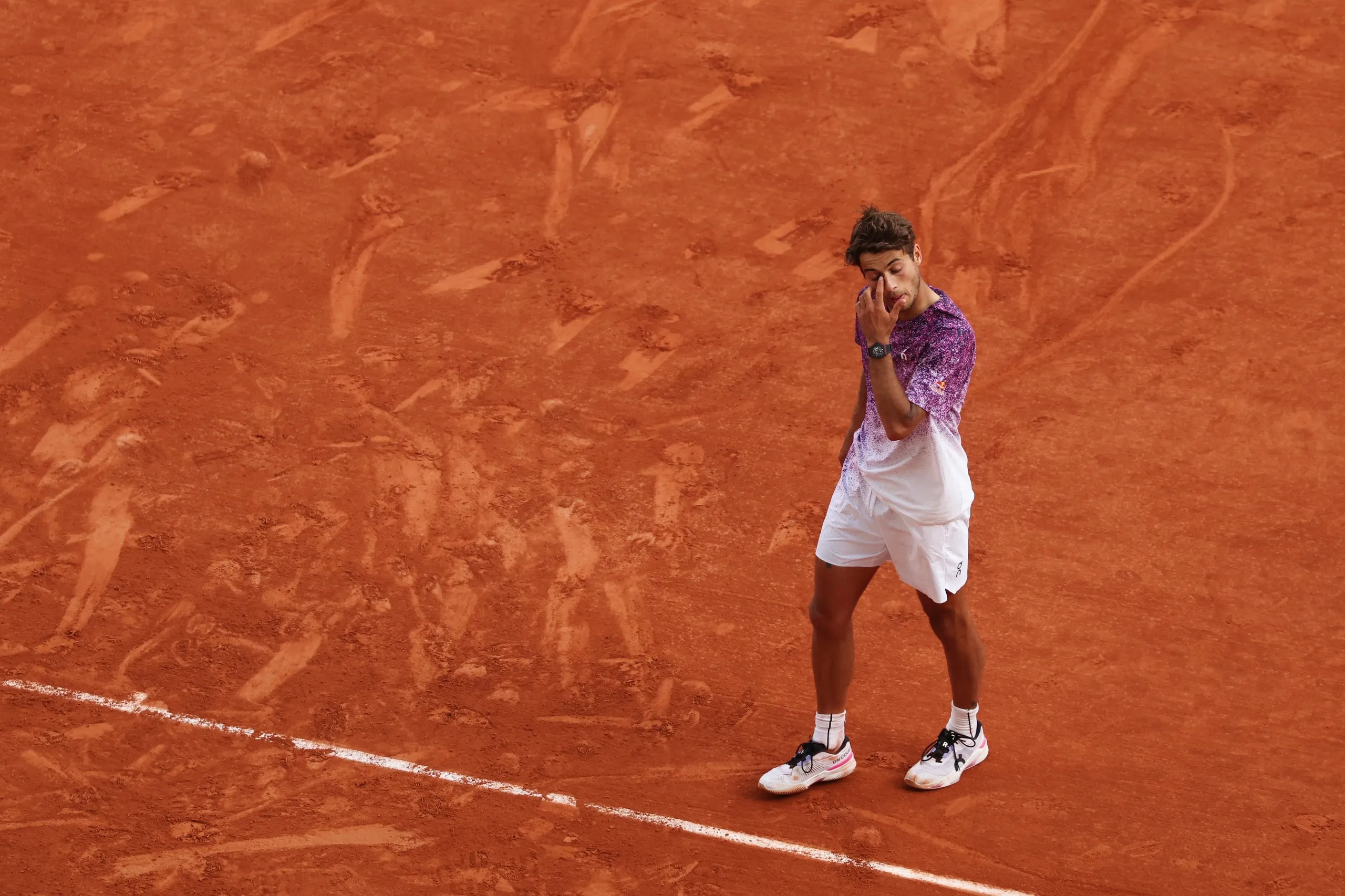 Flavio Cobolli of Italy looks dejected following defeat against Alexander Zverev